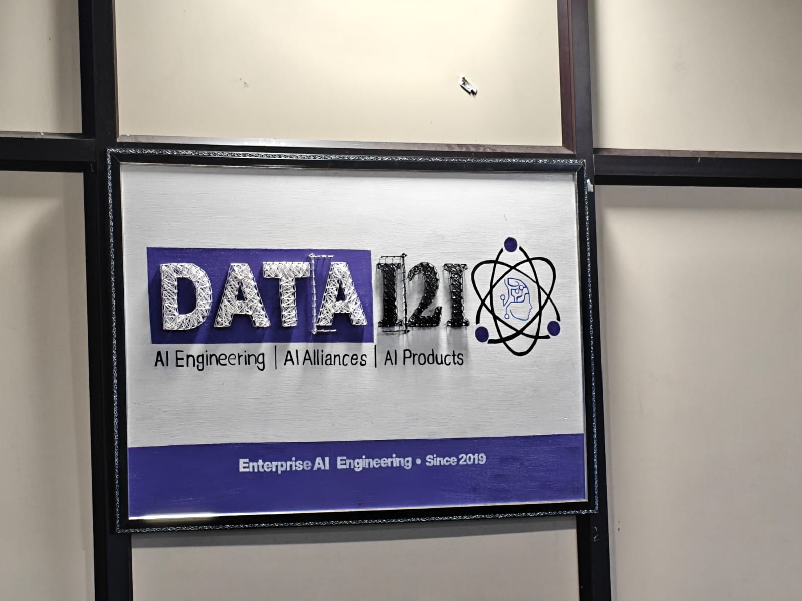 Actual DATAi2i custom corporate string art order in a frame